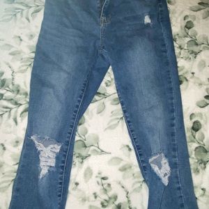 womens size 26 pacsun blue jeans with small rips on front